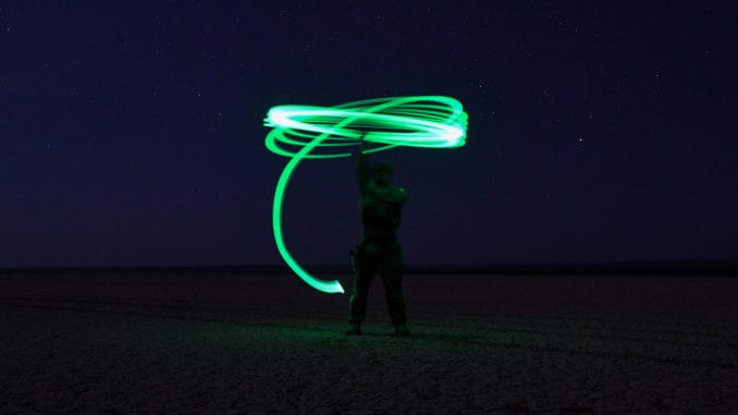Visible light green chemlight being spun for high visibility