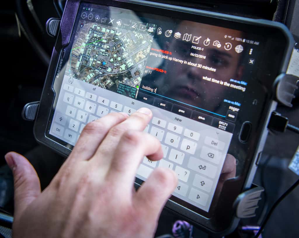 The Android Tactical Assault Kit (ATAK) being used to send a message from a patrol vehicle.
